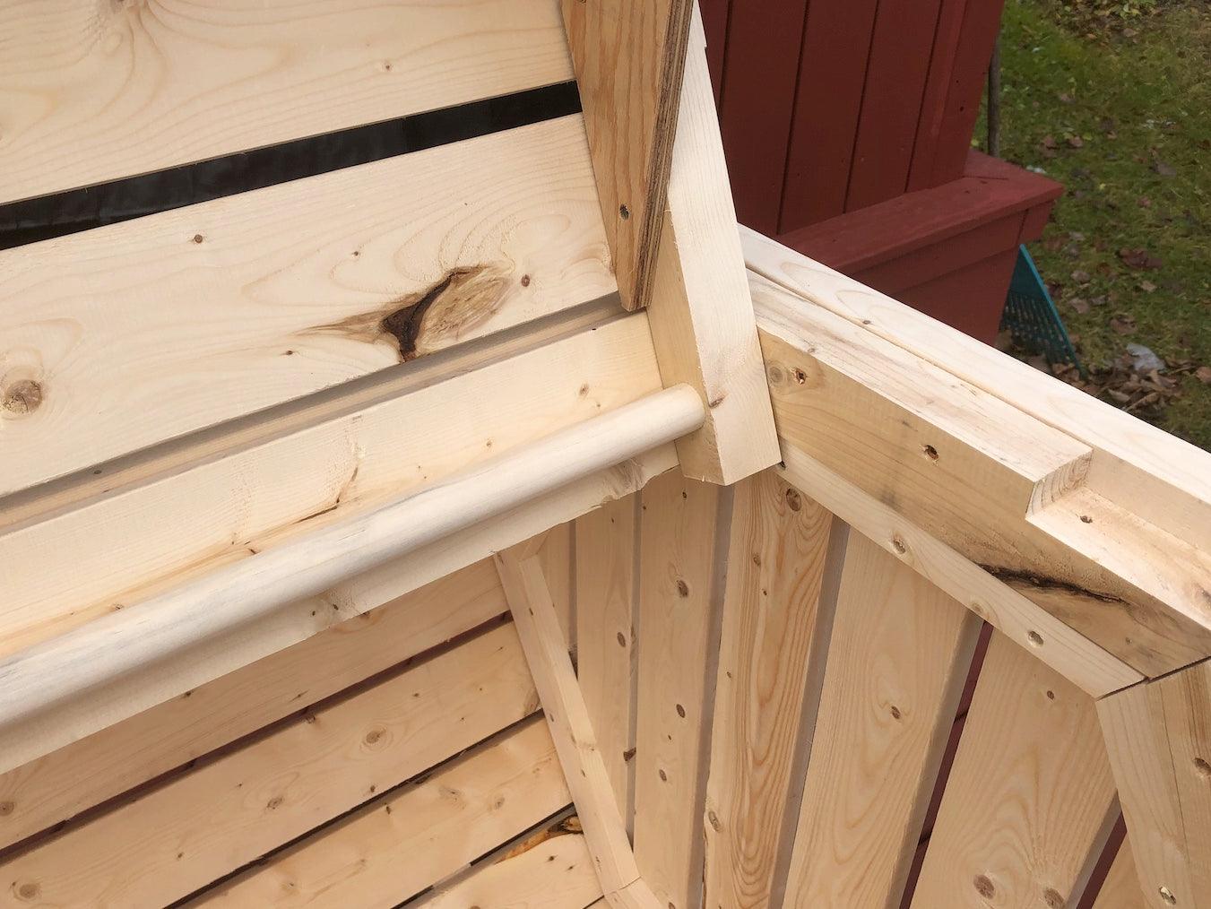 Showing the dowel hinge from our hexagon storage bin woodworking diy plan