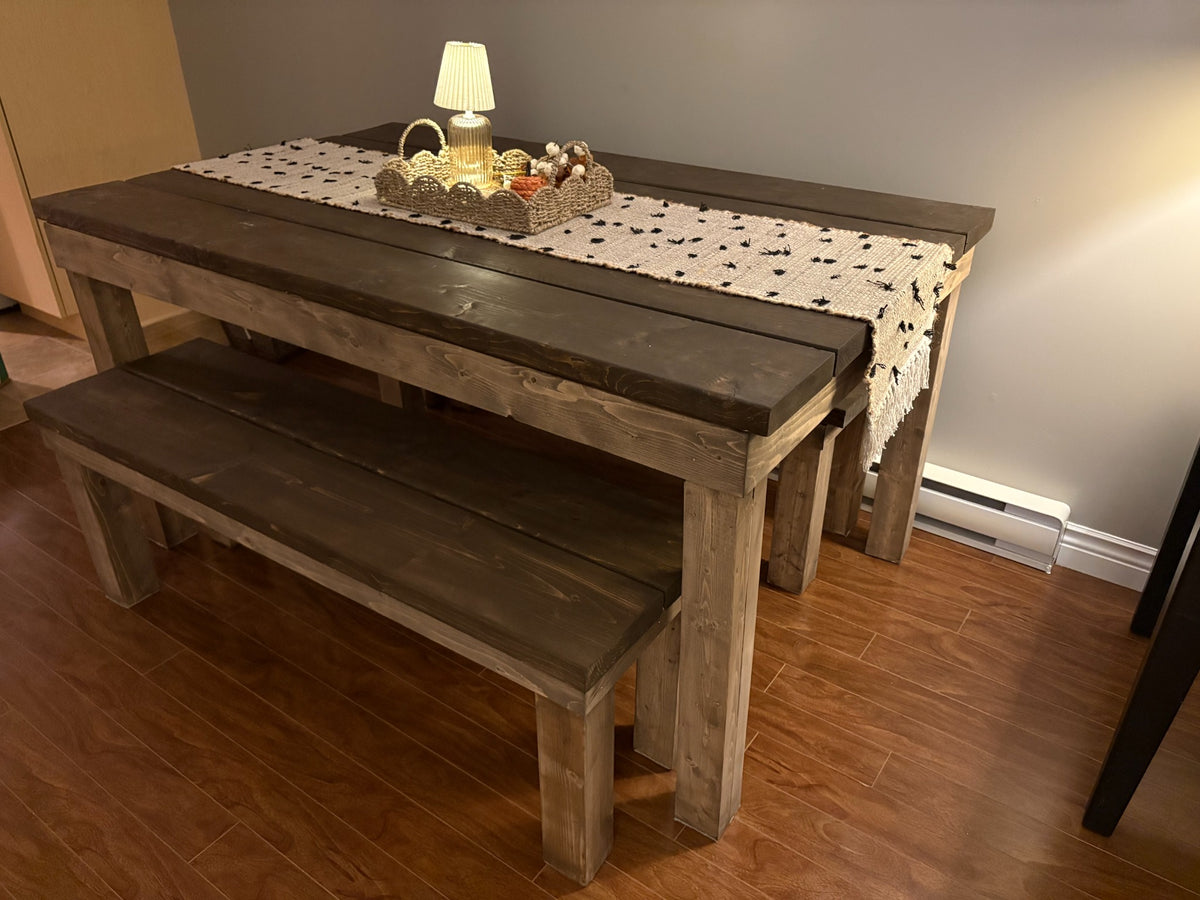 Finished stained wooden table and matching benches showing the space-saving design